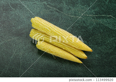 Raw sweet baby corn heap Raw sweet baby corn heap 113499920