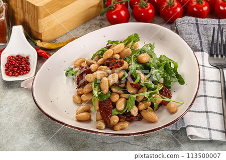 White canned beans with arugula and dry tomatoes White canned beans with arugula and dry tomatoes 113500007