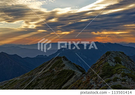 The morning sun shining over Mount Houou as seen from Mount Senjo in the Southern Alps The morning sun shining over Mount Houou as seen from Mount Senjo in the Southern Alps 113501414