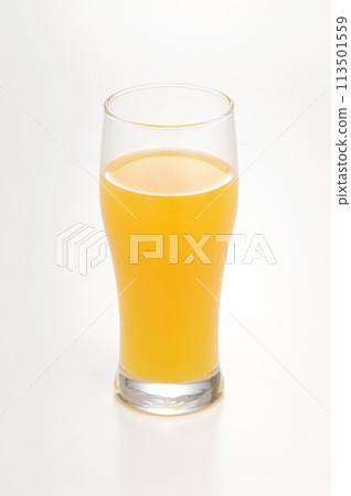 Orange juice in a glass on a white background Orange juice in a glass on a white background 113501559