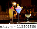 Colorful cocktails lined up on a bar counter 113501560