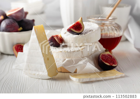 Camembert cheese with figs and honey. Camembert cheese with figs and honey. 113502883