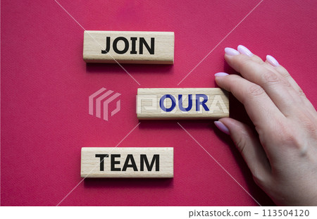 Join our team symbol. Wooden blocks with words Join our team. Beautiful red background. Businessman hand. Business and Join our team concept. Copy space. Join our team symbol. Wooden blocks with words Join our team. Beautiful red background. Businessman hand. Business and Join our team concept. Copy space. 113504120