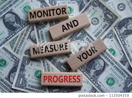 Monitor and Measure your Progress symbol. Wooden blocks with words Monitor and Measure your Progress. Beautiful dollar background. Business and Monitor and Measure your Progress concept. Copy space Monitor and Measure your Progress symbol. Wooden blocks with words Monitor and Measure your Progress. Beautiful dollar background. Business and Monitor and Measure your Progress concept. Copy space 113504359