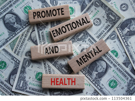 Health symbol. Wooden blocks with words Promote Emotional and Mental Health. Beautiful dollar background with. Health concept. Copy space. 113504361