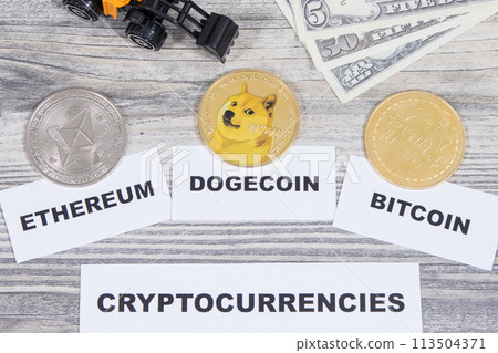 Cryptocurrency coins, miniature excavator and dollars Cryptocurrency coins, miniature excavator and dollars 113504371