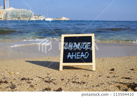 Change ahead symbol. Concept word Change ahead on black chalk background. Beautiful sea background. Business and Change ahead concept. Copy space Change ahead symbol. Concept word Change ahead on black chalk background. Beautiful sea background. Business and Change ahead concept. Copy space 113504410