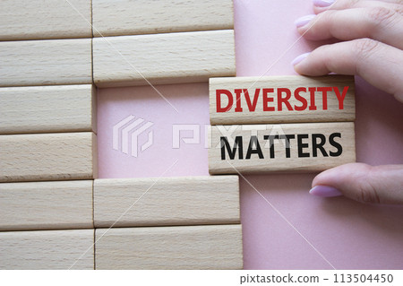 Diversity matters symbol. Wooden blocks with words Diversity matters. Businessman hand. Beautiful pink background. Business and Diversity matters concept. Copy space. Diversity matters symbol. Wooden blocks with words Diversity matters. Businessman hand. Beautiful pink background. Business and Diversity matters concept. Copy space. 113504450