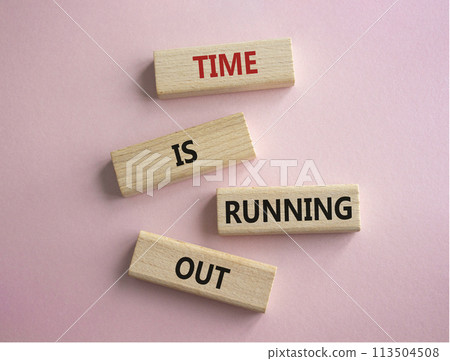 Time is running out symbol. Concept words Time is running out on wooden blocks. Beautiful pink background. Business and Time concept. Copy space. Time is running out symbol. Concept words Time is running out on wooden blocks. Beautiful pink background. Business and Time concept. Copy space. 113504508