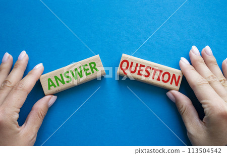 Answer or Question symbol. Concept word Answer or Question on wooden blocks. Businessman hand. Beautiful blue background. Business and Answer or Question concept. Copy space Answer or Question symbol. Concept word Answer or Question on wooden blocks. Businessman hand. Beautiful blue background. Business and Answer or Question concept. Copy space 113504542