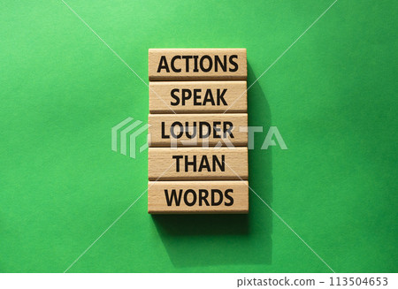 Actions speak louder than Words symbol. Wooden blocks with words Actions speak louder than Words. Beautiful green background. Business and Actions concept. Copy space. 113504653