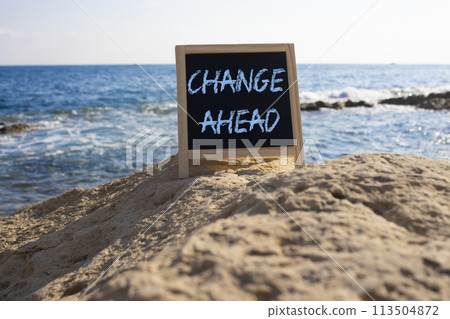 Change ahead symbol. Concept word Change ahead on black chalk background. Beautiful sea background. Business and Change ahead concept. Copy space 113504872
