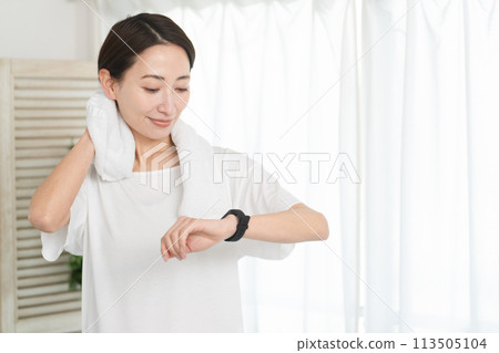 Young woman looking at smartwatch Sports image 113505104