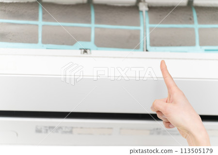Young woman cleaning air conditioner filters Lifestyle image 113505179