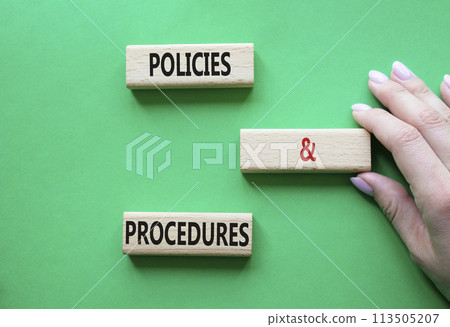 Policies and Procedures symbol. Concept words Policies and Procedures on wooden blocks. Beautiful green background. Businessman hand. Business and Policies and Procedures concept. Copy space. Policies and Procedures symbol. Concept words Policies and Procedures on wooden blocks. Beautiful green background. Businessman hand. Business and Policies and Procedures concept. Copy space. 113505207