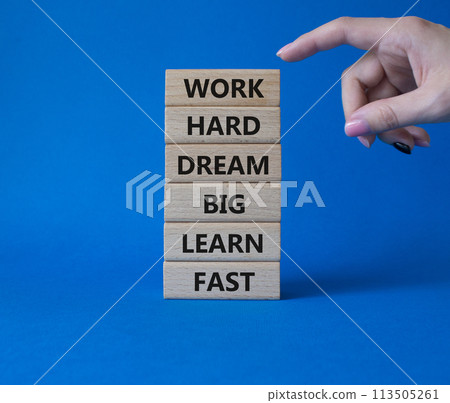 Work hard Dream big Learn fast symbol. Wooden blocks with words Work hard Dream big Learn fast. Beautiful blue background. Businessman hand. Business and Work hard Dream big Learn fast. Copy space. 113505261
