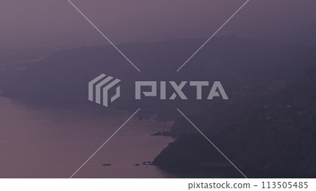 Nght is falling over sea cliff coast. 113505485