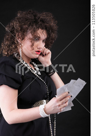 Worried woman calculating her bills Worried woman calculating her bills 113505826
