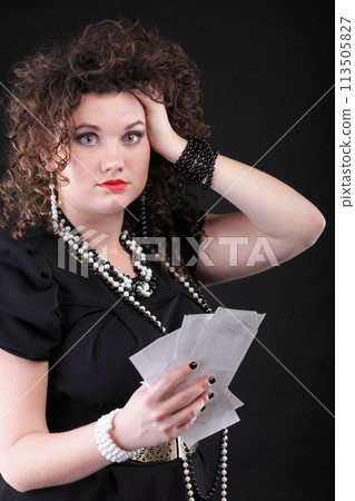 Worried woman calculating her bills Worried woman calculating her bills 113505827