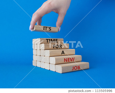 It is time for a new job symbol. Concept words It is time for a new job on wooden blocks. Businessman hand. Beautiful blue background. Business concept. Copy space. 113505996