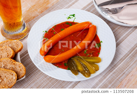 Viennese sausages with goulash sauce on served table Viennese sausages with goulash sauce on served table 113507208