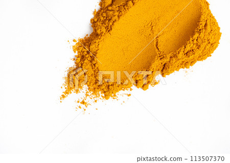 A smear of turmeric on a white background, top view 113507370