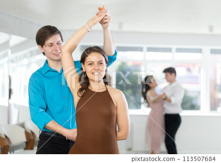 Young girl dancing sensual bachata in choreography studio Young girl dancing sensual bachata in choreography studio 113507684