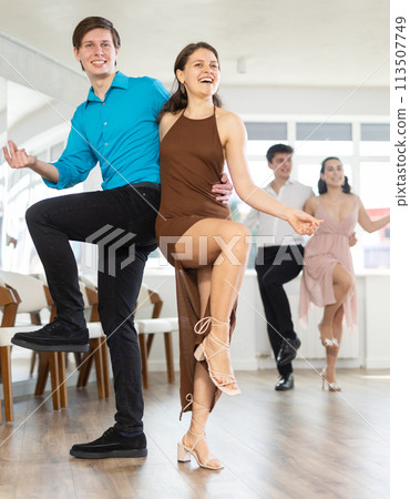 Couple young woman and man dancing twist 113507749