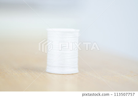 Yarn on brown table. 113507757