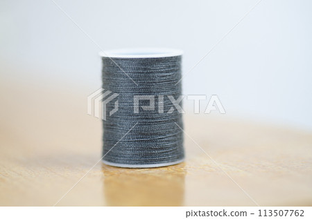 Yarn on brown table. Yarn on brown table. 113507762