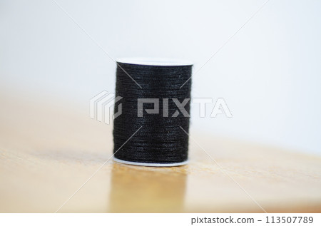 Yarn on brown table. 113507789