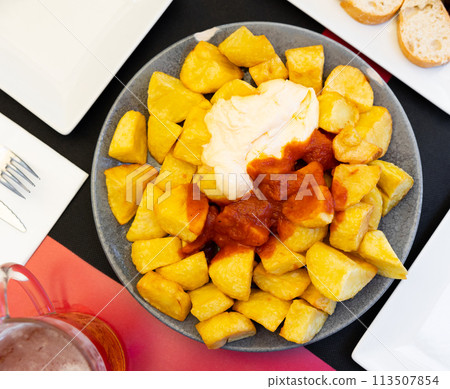 Baked potatoes with creamy sauce aioli and tomato salsa Baked potatoes with creamy sauce aioli and tomato salsa 113507854