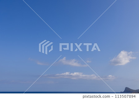 Expansive blue sky and serene waters over Ibiza highlight Cape Nono, Balearics Expansive blue sky and serene waters over Ibiza highlight Cape Nono, Balearics 113507894