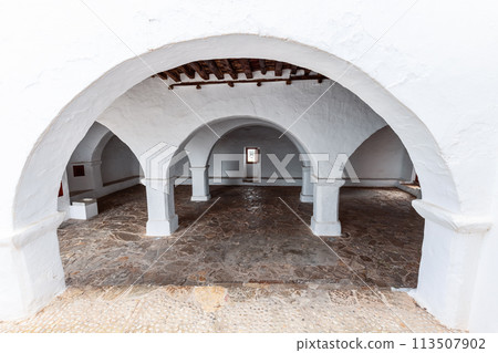 Covered courtyard in Puig de Missa reveals serene white arches, Santa Eulalia Covered courtyard in Puig de Missa reveals serene white arches, Santa Eulalia 113507902