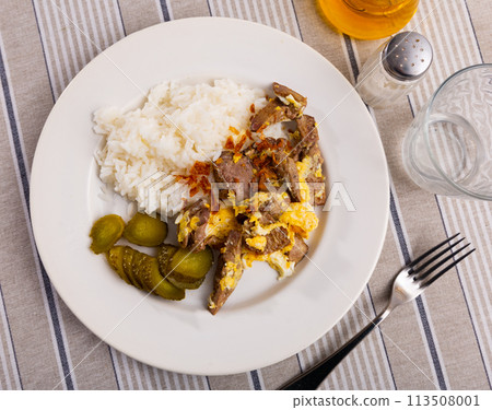 Omelet fried with rabbit liver served with rice and pickles Omelet fried with rabbit liver served with rice and pickles 113508001