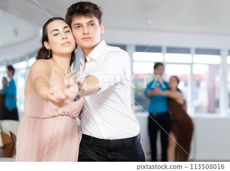 Couple young woman and man dancing waltz Couple young woman and man dancing waltz 113508016