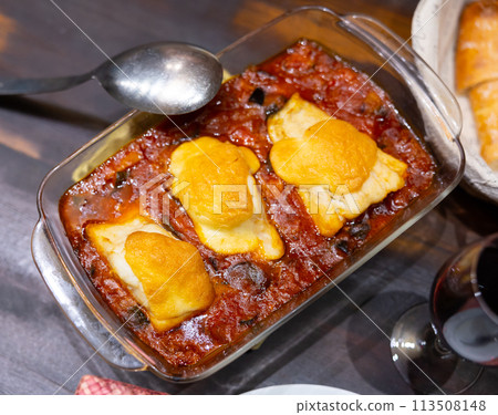 Traditional dish of Portuguese cuisine is Bacalao 113508148