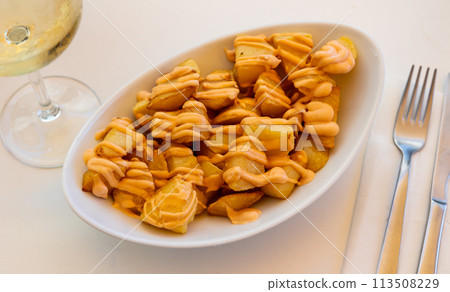Portion of just cooked patatas bravas Portion of just cooked patatas bravas 113508229