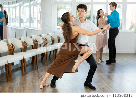 Couple young woman and man dancing tango 113508312