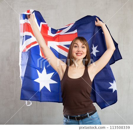 Young happy pretty woman displaying flag of australia Young happy pretty woman displaying flag of australia 113508339