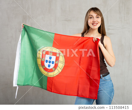 Young pretty woman proudly displaying flag of portugal 113508415