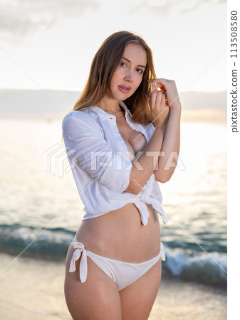 Portrait of sensual young lady enjoying warm, tropical ocean water Portrait of sensual young lady enjoying warm, tropical ocean water 113508580