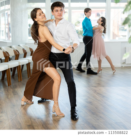 Tango performed by young couple in choreographic studio 113508822