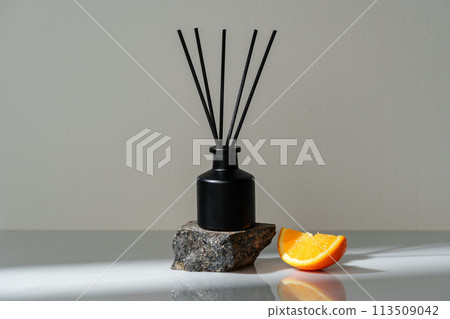 Aromatic Reed Diffuser on a Stone Base With Orange Slice Accent Aromatic Reed Diffuser on a Stone Base With Orange Slice Accent 113509042
