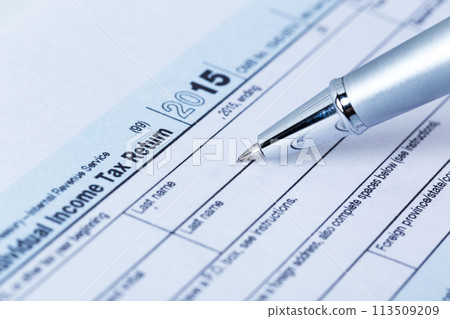 Income tax form and pen Income tax form and pen 113509209