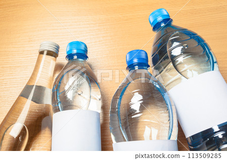 water bottle on the wooden table 113509285
