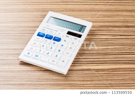 Digital calculator on table close-up Digital calculator on table close-up 113509550