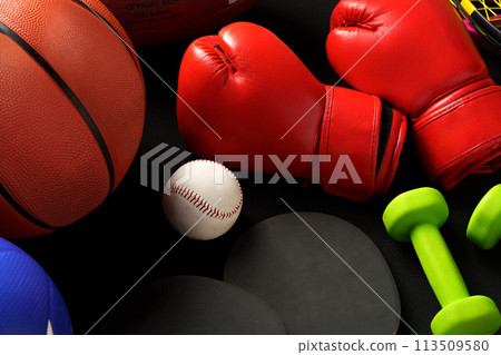 Various sports equipment on black background studio shot Various sports equipment on black background studio shot 113509580