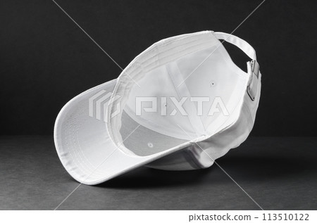 White Baseball Cap on Black Background White Baseball Cap on Black Background 113510122