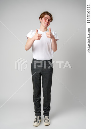 Young Man Giving Thumbs Up Sign 113510411